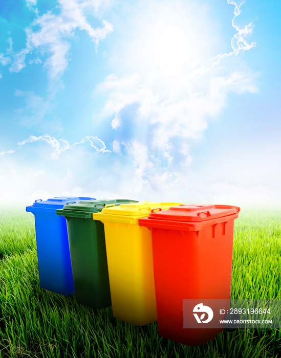 Colorful recycle bins with landscape background