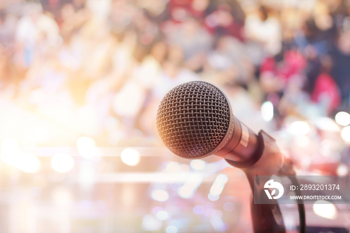 Microphone on stage in concert with people background