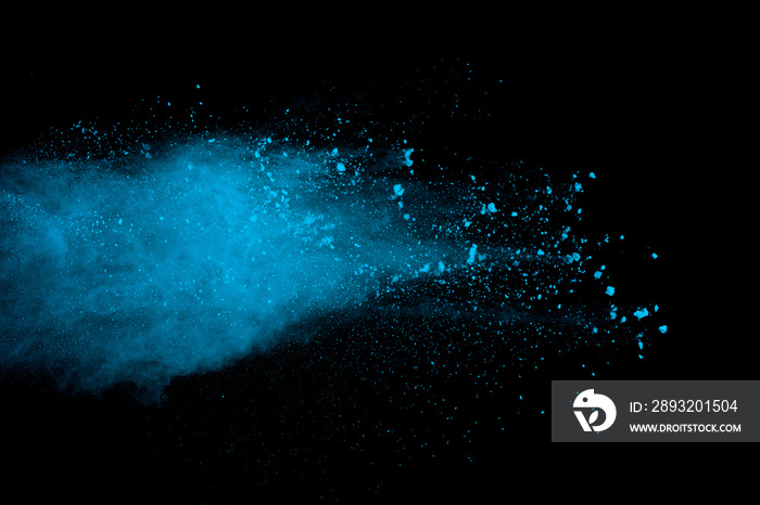 Abstract blue powder splatted background. Colorful powder explosion on black background. Colored clo
