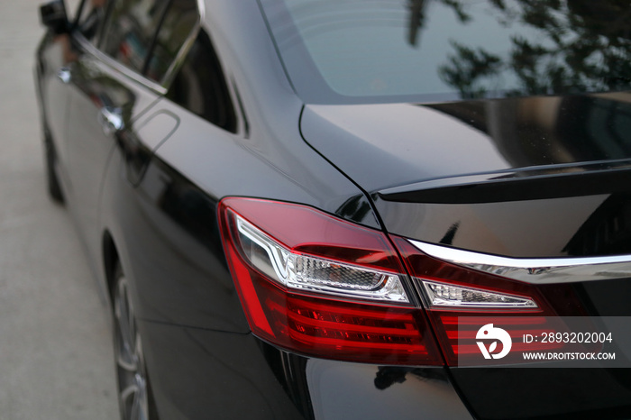 red taillight of black modern sport car