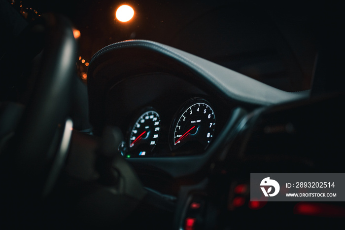 dashboard of a sports car at night