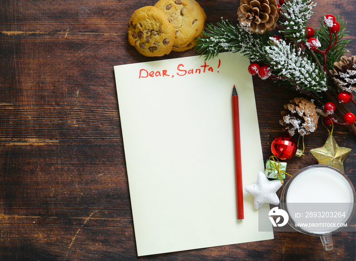 Cookies and a glass of milk for Santa. Christmas decorations