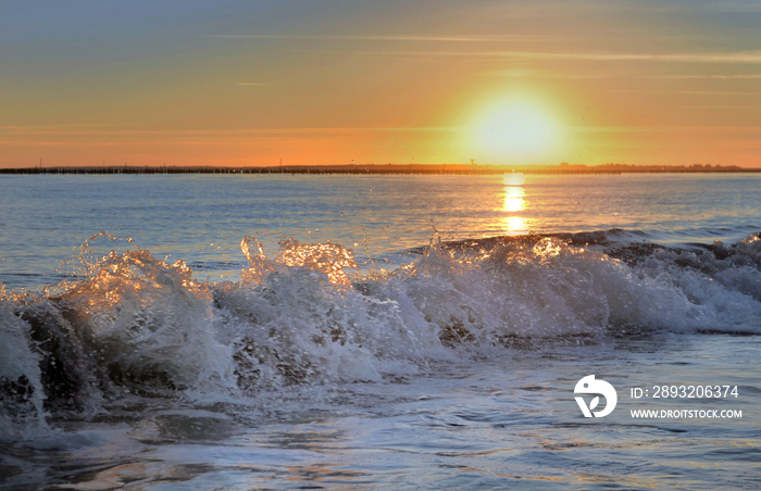 beautiful sunset on the waves of Atlantic ocean in France