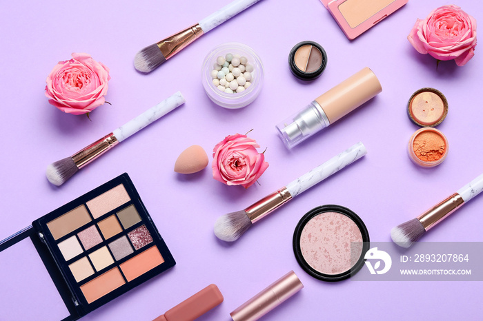 Cosmetic products and flowers for International Womens Day celebration on purple background