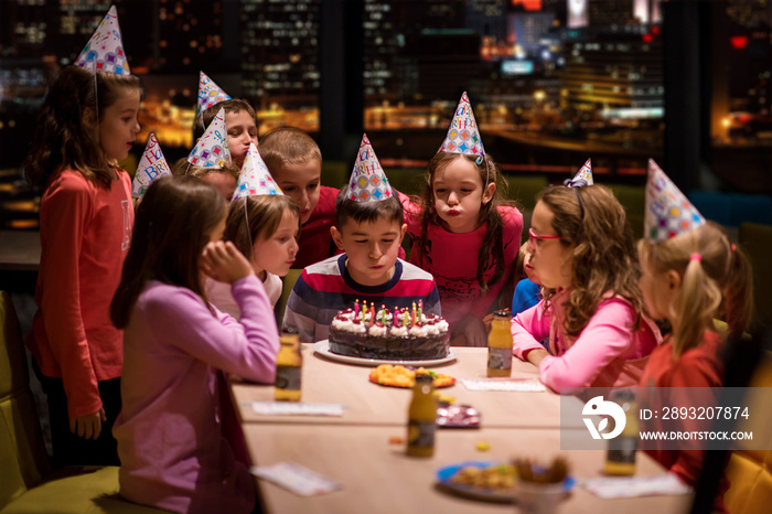 happy young boy having birthday party