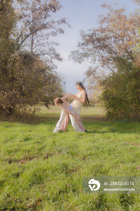 women in nature dancing