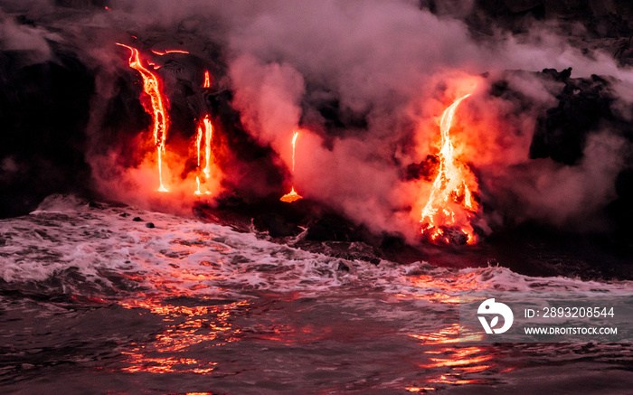 Lava is flowing from volcano Kīlauea to Pacific ocean at night