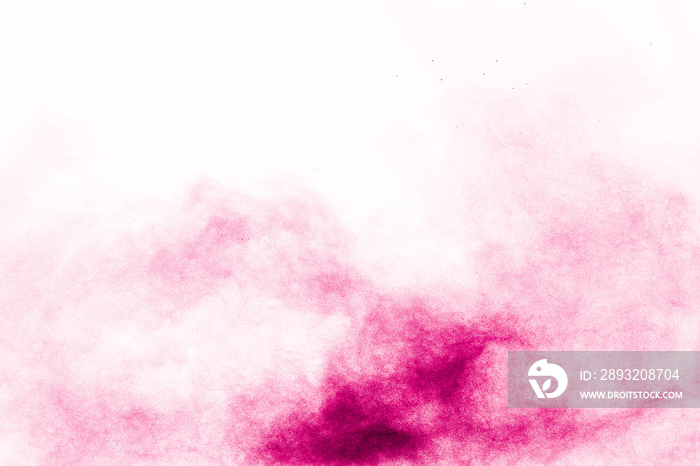 抽象的深粉色粉末在白色背景下爆炸。深粉色粉末飞溅的冻结运动。