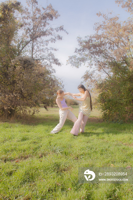 women in nature dancing