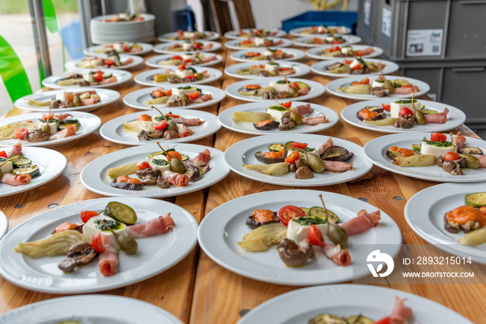 plates with antipasti appetizers