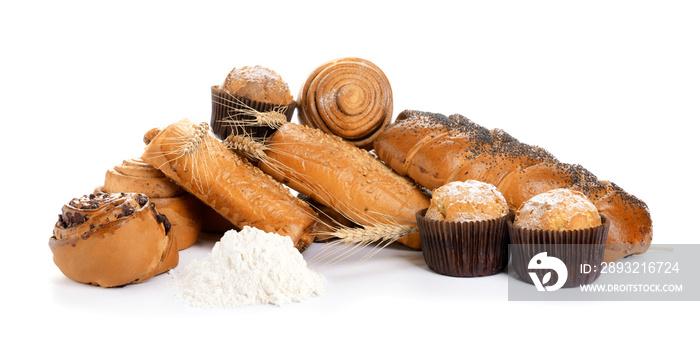 Heap of tasty pastries on white background