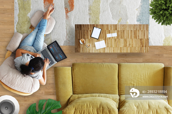 Woman working from home from living room