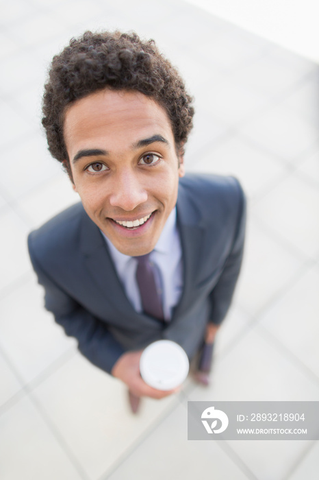 Portrait confident businessman with coffee