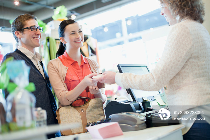 Woman paying for purchase at stationery store