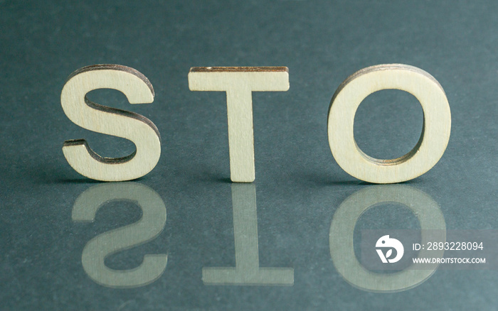 Security Token Offering STO sign with wooden letters, Ethereum concept