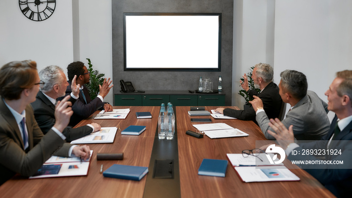 Business meeting. Group of multicultural business people having video conference while sitting in th