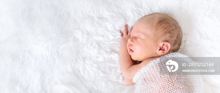 Newborn baby sleeping on a white background. Selective focus.