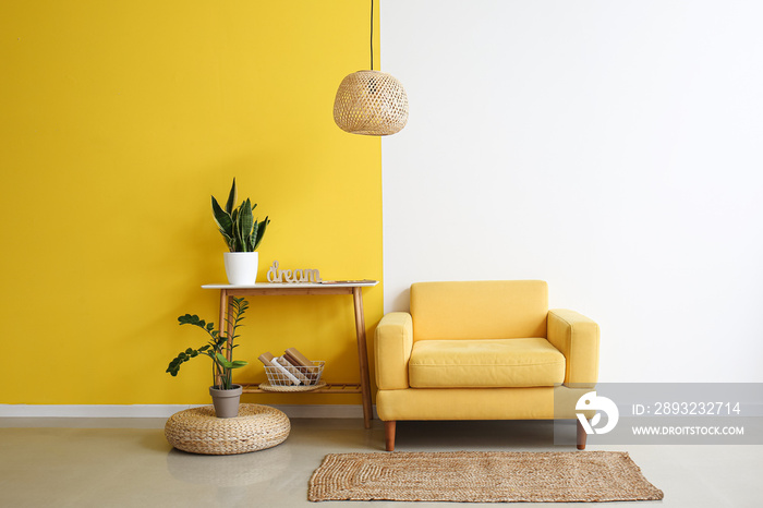 Interior of stylish living room with yellow armchair and table