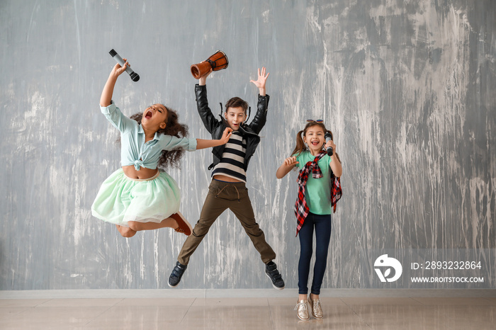 Band of little musicians against grunge wall