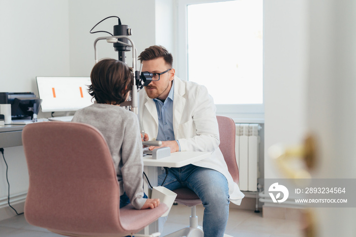 boy having eyesight test on clinic