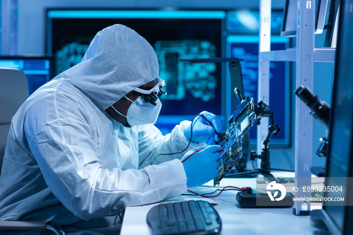 African-American scientist works in a modern scientific laboratory for the research and development 