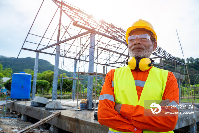 Construction workers wearing safety clothing  standing at construction site,Building Inspector.