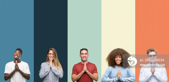 Group of people over vintage colors background praying with hands together asking for forgiveness sm