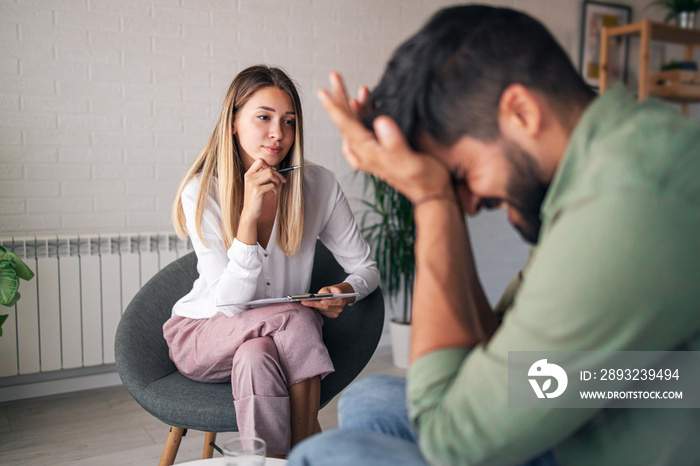 Psychotherapist listening to emotionally unstable patient