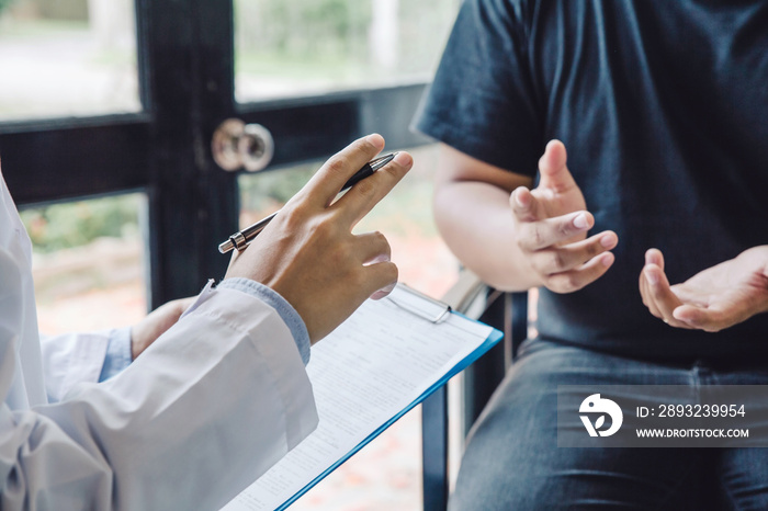 Young doctor explaining for patient at consulting room