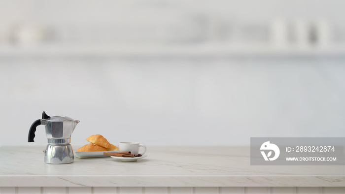 Cropped shot of fruit basket and copy space on marble desk with blurred kitchen room