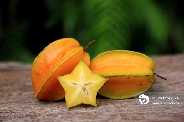 Carambola or star apple ( starfruit ) on old wooden background,Close up healthy carambola or star ap