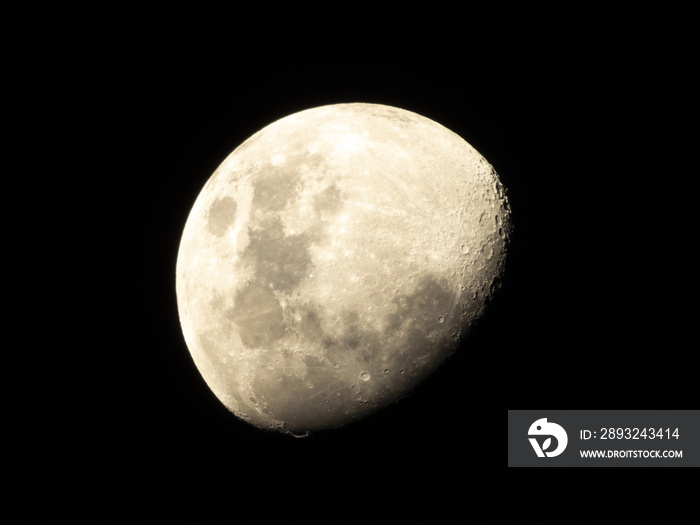 Half Moon, Crescent moon, gibbous moon in the middle of its way on the clear sky.