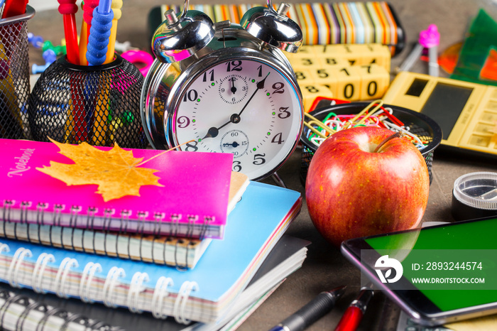 Back to school. Items for school activities rotate on the table.