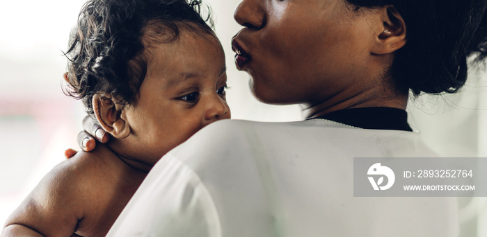 Portrait of enjoy happy love family african american mother playing with adorable little african ame