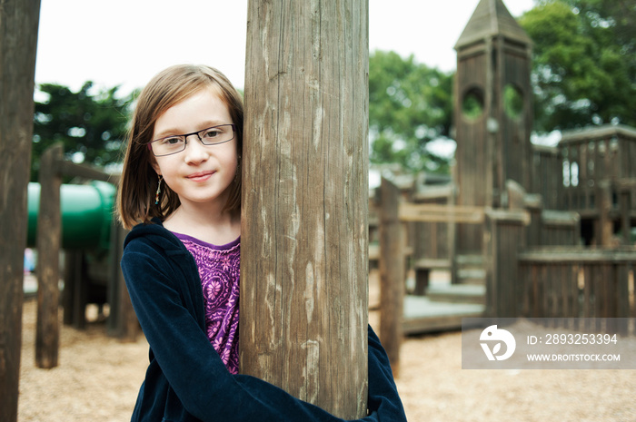 Portrait of girl (8-9) on playground