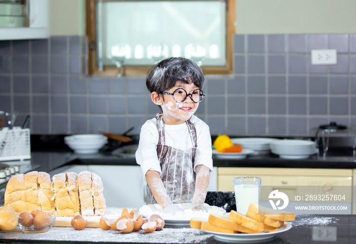 Boy playing naughty in the kitchen