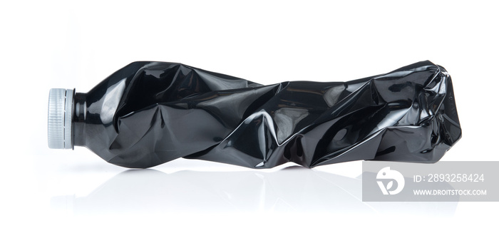 Black water bottles crushed and crumpled against white isolated background