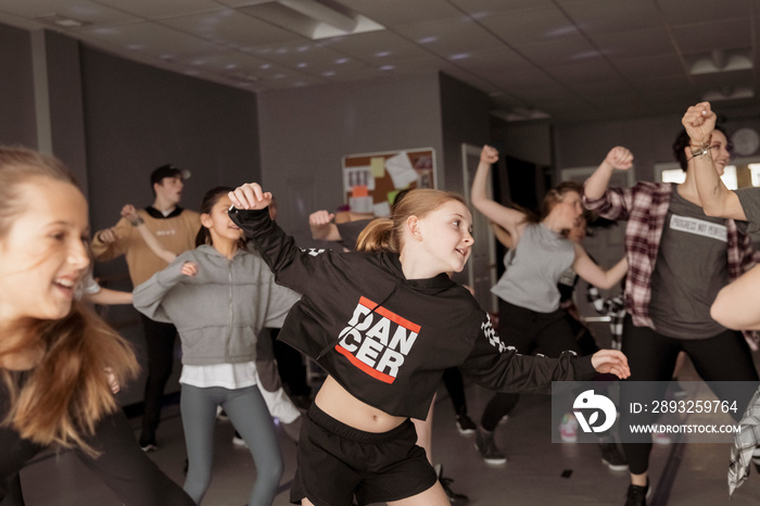 Dancers practicing hip-hop dance in studio