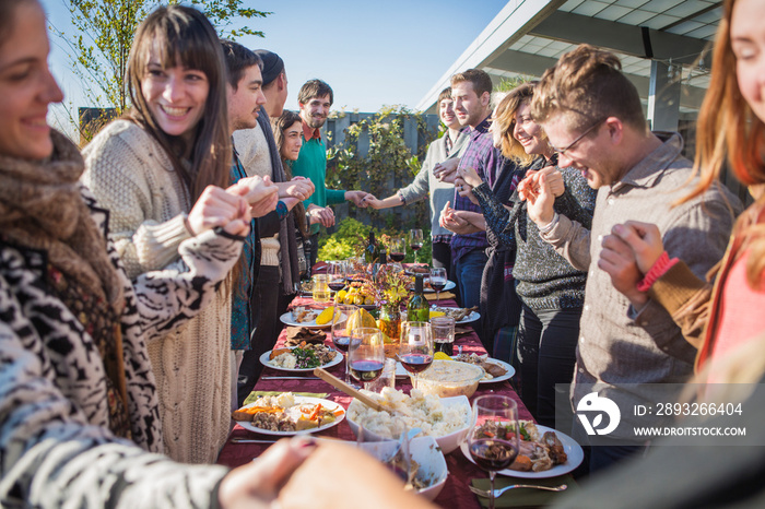 Friends enjoying party in backyard