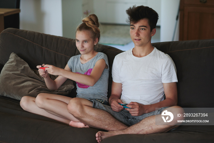 Boy and girl playing video games