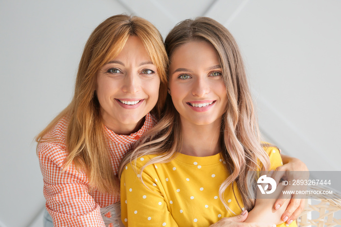 Happy mother and daughter at home