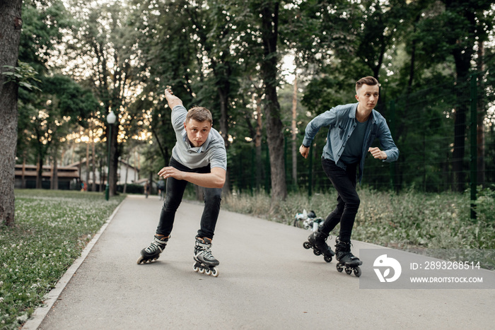 Roller skating, two male skaters begins speed race