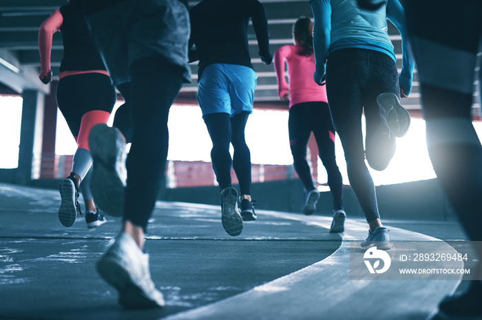 Young athletes training on race track