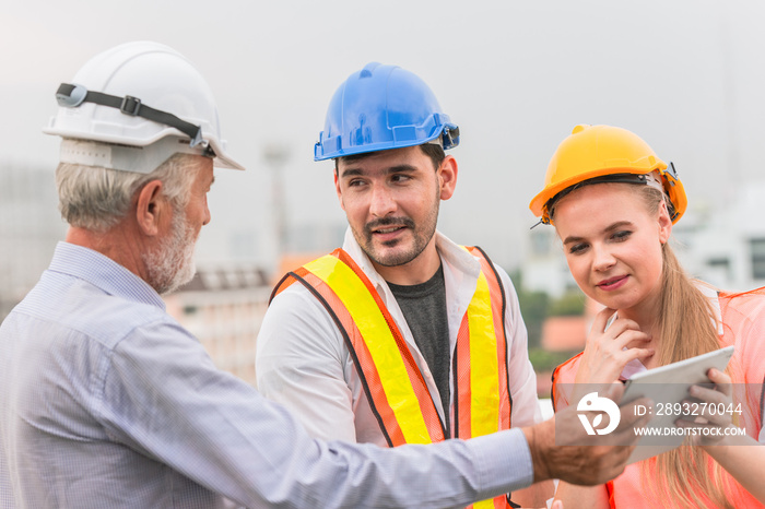 Engineer Teamwork consult together looking project at tablet