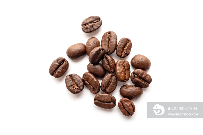 Roasted coffee beans isolated on white background. Close-up.