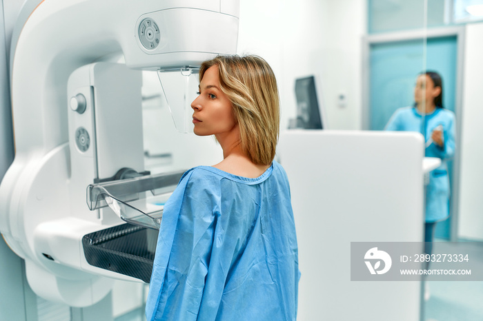 In the hospital, the patient undergoes a screening procedure for a mammogram, which is performed by 