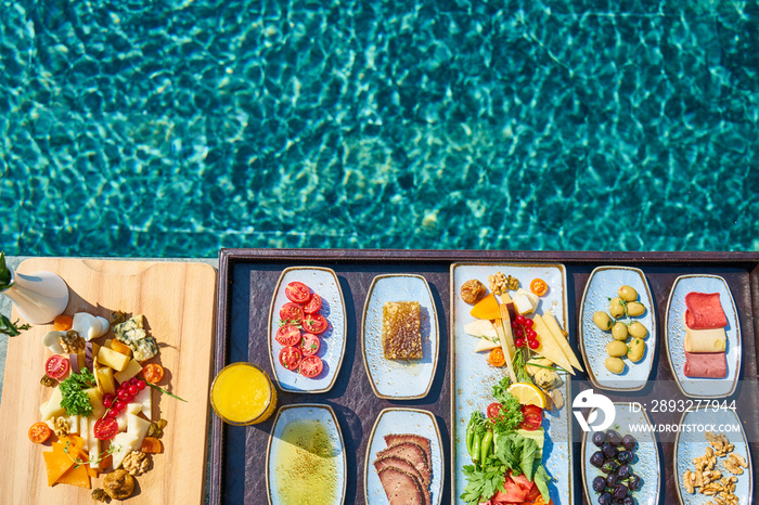 Breakfast in luxury hotel pool