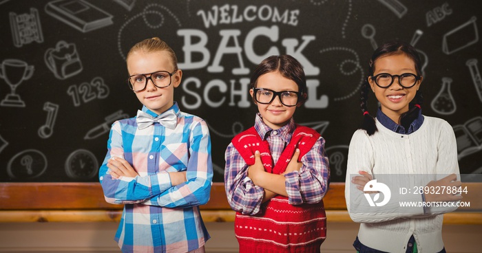 Composite image of three school kids with arms crossed