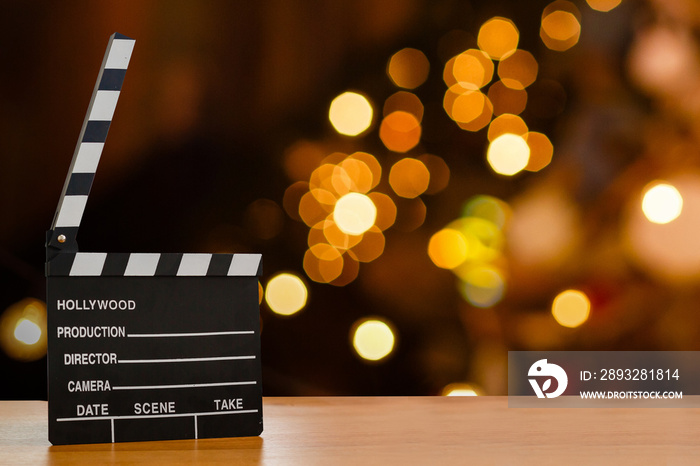 Slate film, Film clapper or Movie director slate on wood table. Blur and bokeh on background. for pr