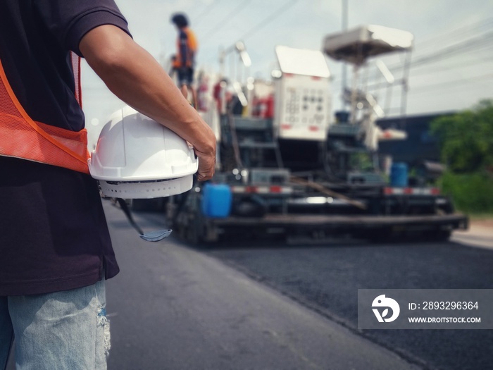 White hat and road construction (picture blurred)